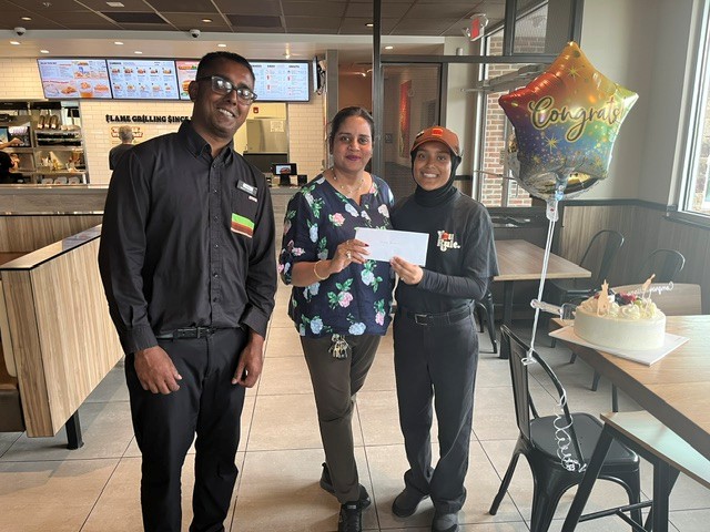 A scholarship winner receiving her award